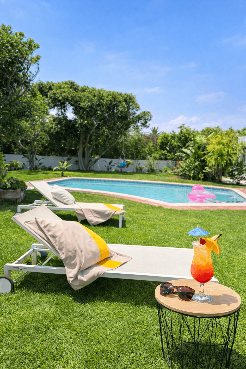 Poolside with cocktail